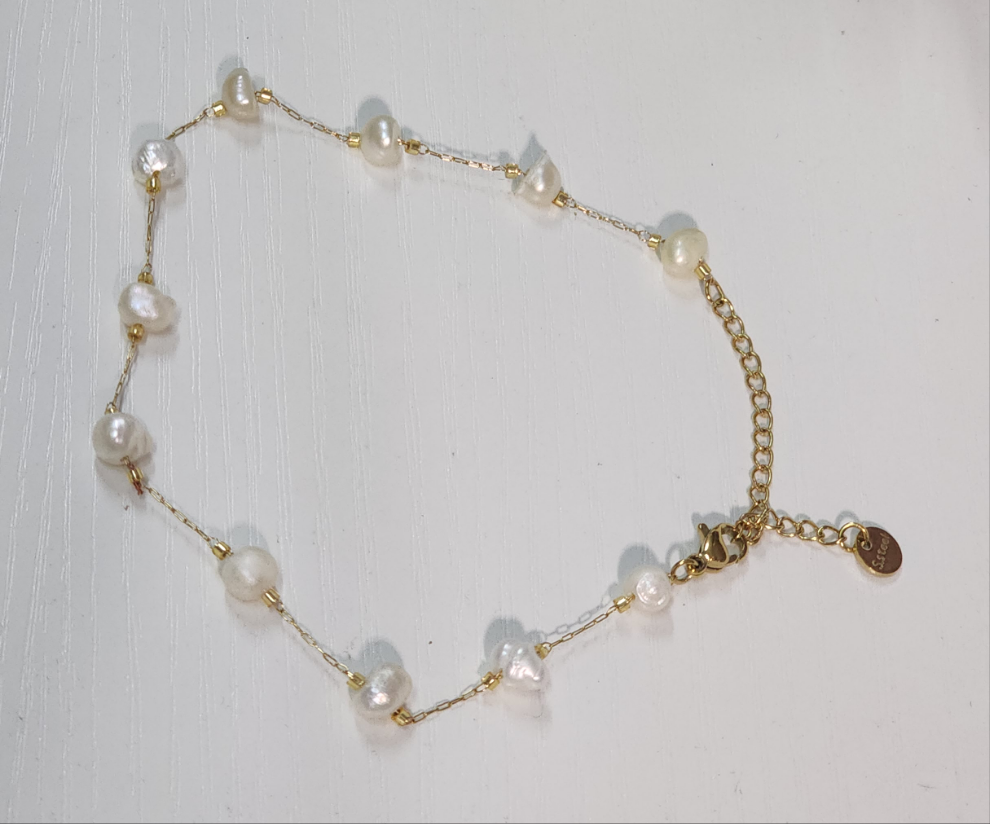 Tobillera de perlas.